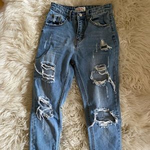 blue straight legged ripped jeans